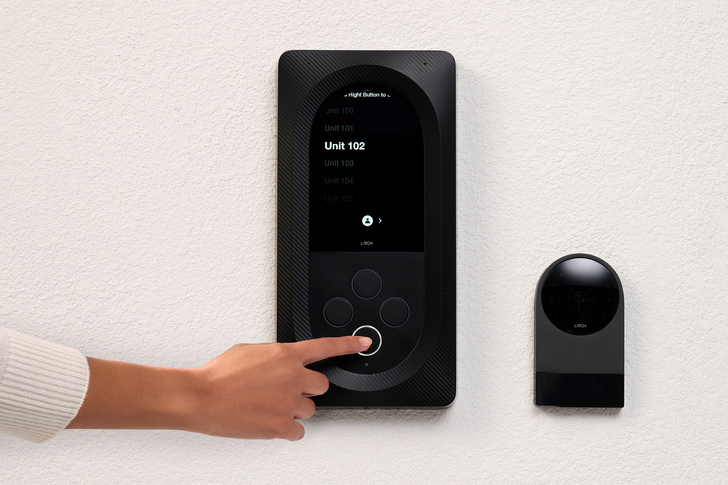 Resident at residential lobby intercom panel